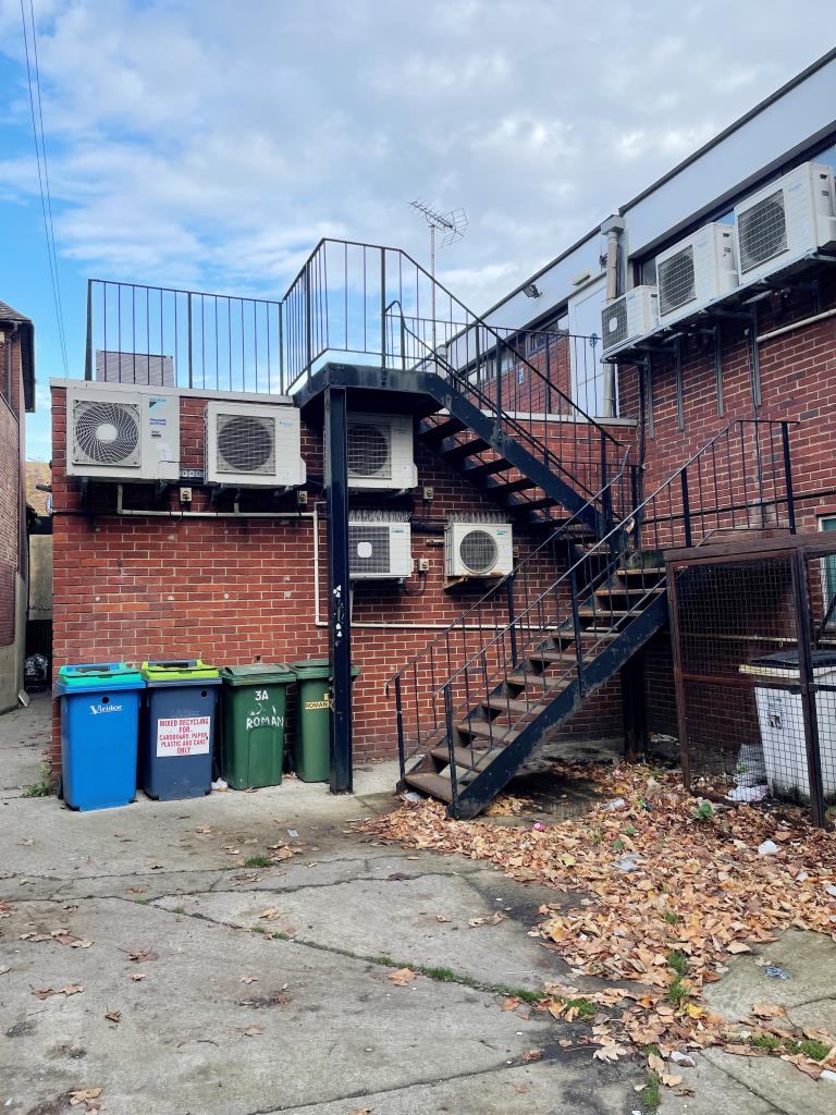 Lot: 17 - TOWN CENTRE FLAT FOR INVESTMENT - External staircase leading to flat